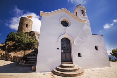 Low angle view of church against blue sky