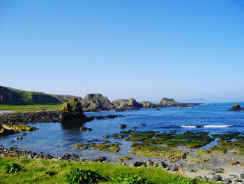 Scenic view of sea against clear blue sky