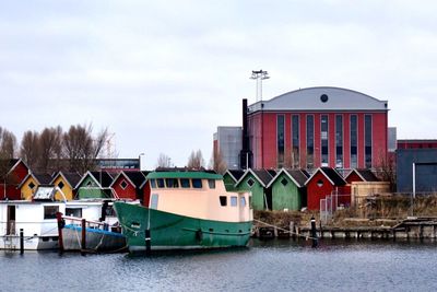 Boats moored in river