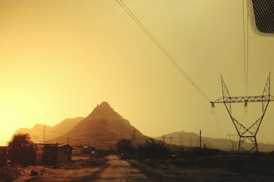 Scenic view of mountain against clear sky during sunset