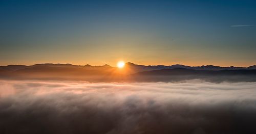 Scenic view of dramatic sky during sunset