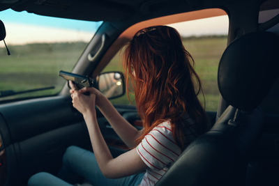 Woman sitting in car