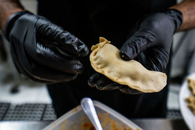 Midsection of person preparing food