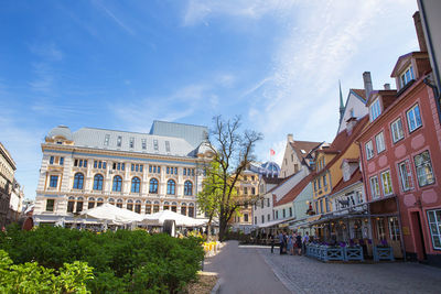 Buildings in city against sky