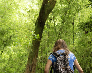 Rear view of a woman in forest