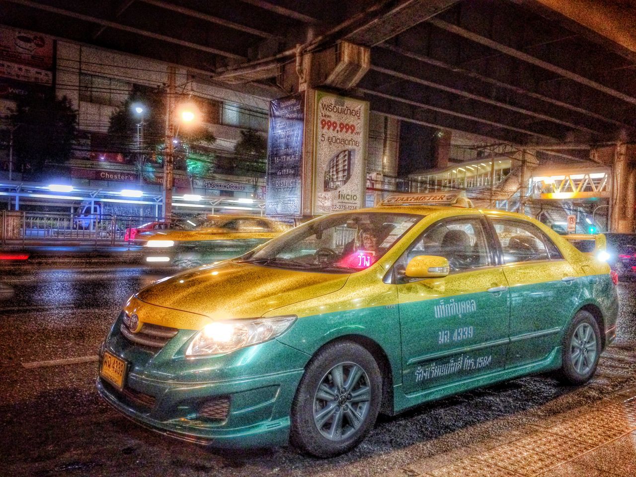 transportation, mode of transport, land vehicle, car, night, illuminated, street, headlight, architecture, stationary, built structure, building exterior, road, city, travel, no people, parking, outdoors, parked, reflection