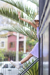 Portrait of girl against plants