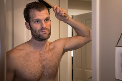 Portrait of young man in bathroom