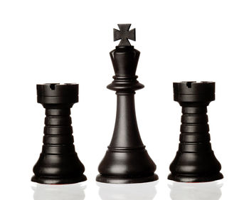 Close-up of chess board against white background