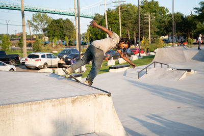 Full length of man skateboarding on skateboard