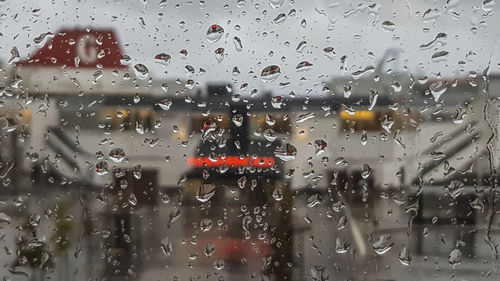 Full frame shot of wet glass window in rainy season