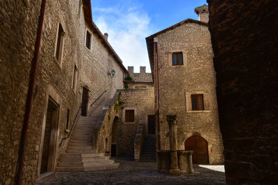 Low angle view of old buildings against sky