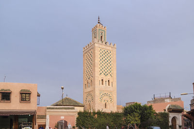 Low angle view of clock tower against sky in city