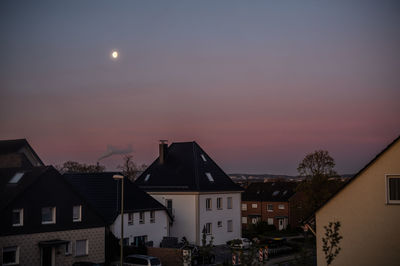 Buildings against sky at night