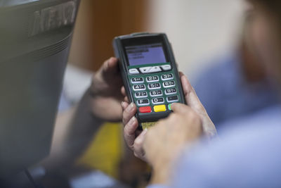Customer using credit card reader at store