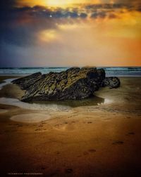 Scenic view of sea against sky at sunset