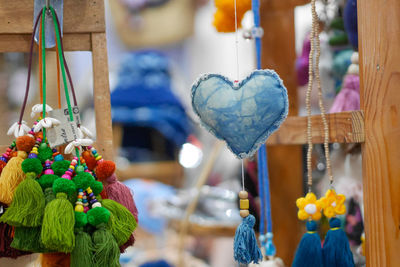 Close-up of decorations hanging for sale