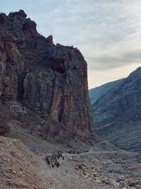 Rock formations on landscape against sky