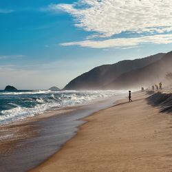 Scenic view of beach against sky during sunset