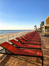 Scenic view of beach against clear blue sky