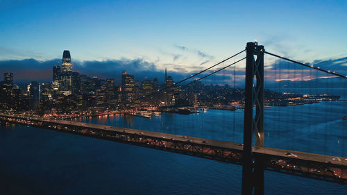 Illuminated bridge over river against sky at night,san diego california 