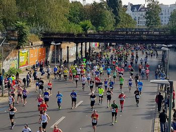 High angle view of people walking on road