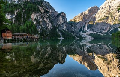 Scenic view of lake and mountains against sky