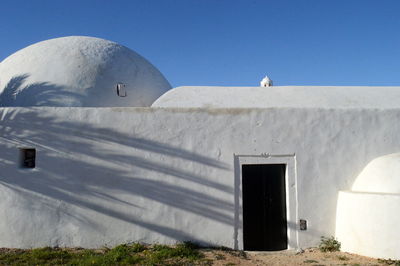 White building against clear sky