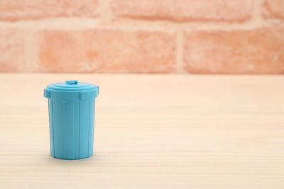 High angle view of dustbin on hardwood floor