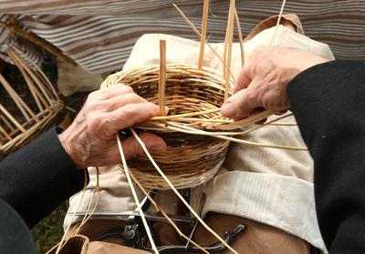 Close-up of man hand holding basket