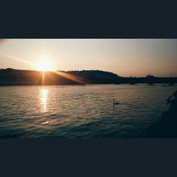 Scenic view of lake at sunset