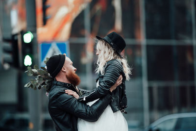 Midsection of couple with hands