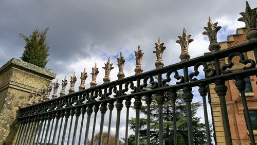 Low angle view of building against cloudy sky