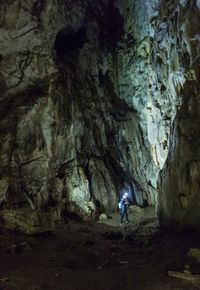 Man standing in cave