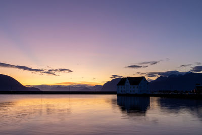 Scenic view of lake against sky during sunset
