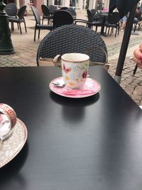 Close-up of coffee served on table at cafe