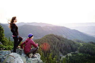 Couple on cliff looking at view