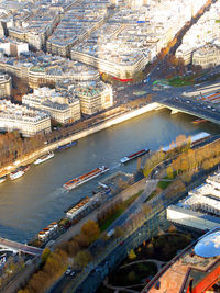 High angle view of river and buildings in city