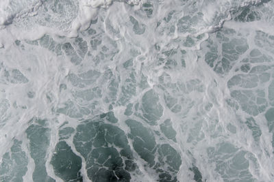 Full frame shot of foaming sea alongside a ship