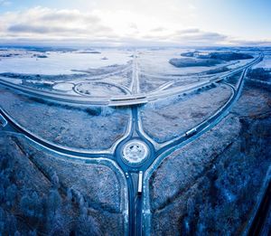 Aerial view of landscape against sky during winter