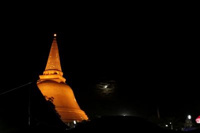 Low angle view of illuminated temple against sky at night