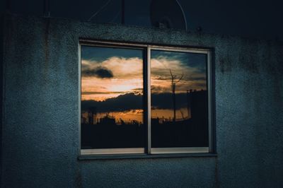 Sunset seen through window