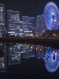 View of modern building lit up at night