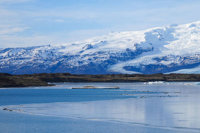 Scenic view of snowcapped mountains against sky