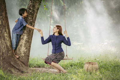 Full length of woman standing on field