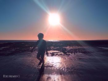 People on beach at sunset