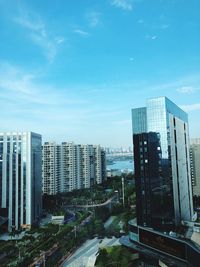 Modern buildings in city against sky