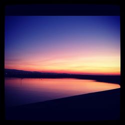 Scenic view of sea against sky at sunset