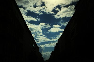 Low angle view of built structure against cloudy sky