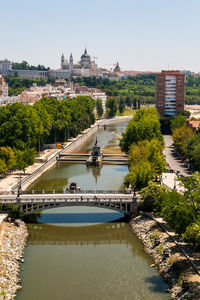 High angle view of bridge over river against buildings